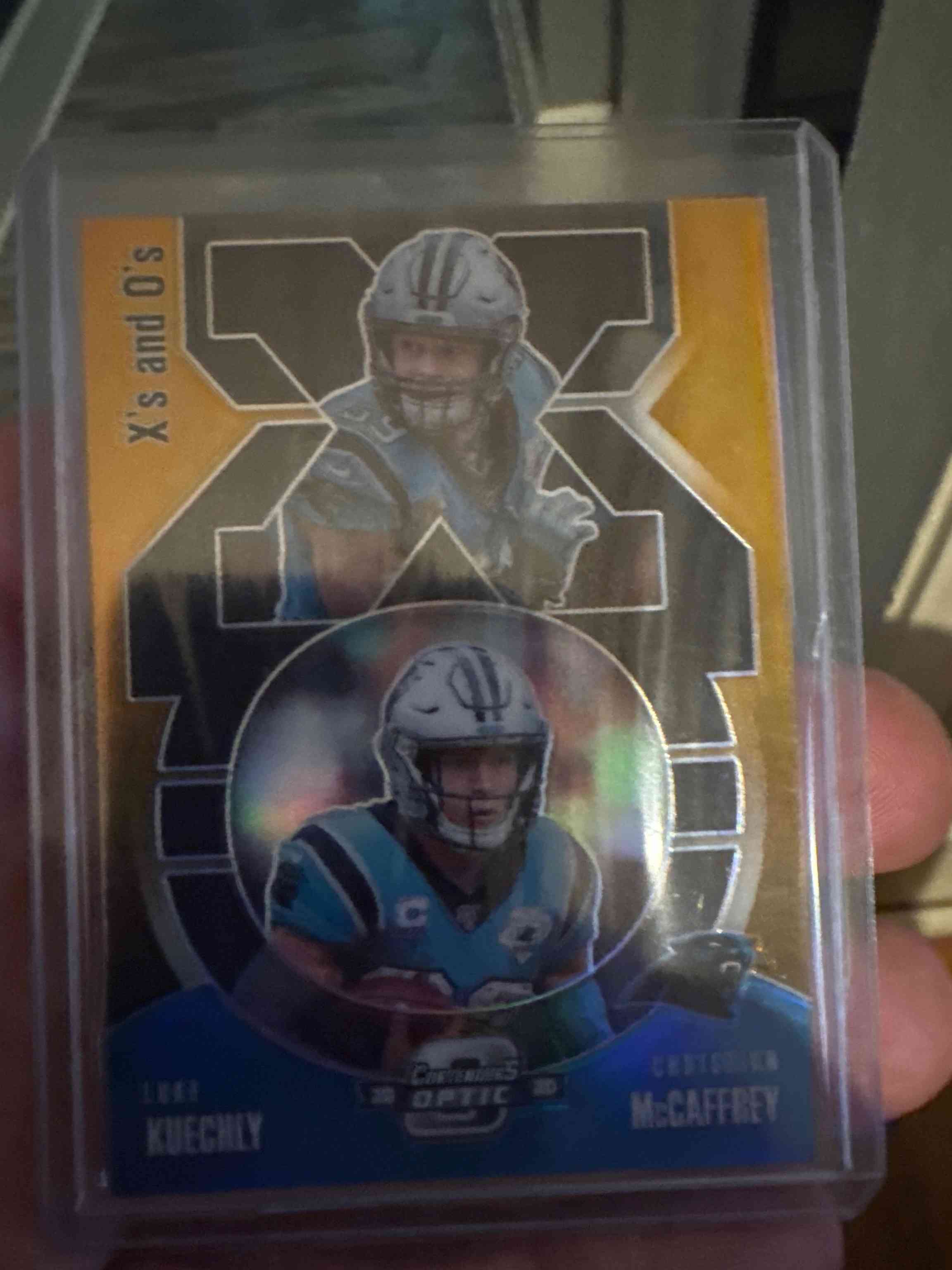 Image for 2020 Panini Contenders Optic Xs and Os Gold Christian McCaffrey Luke Kuechly #XO4 /10